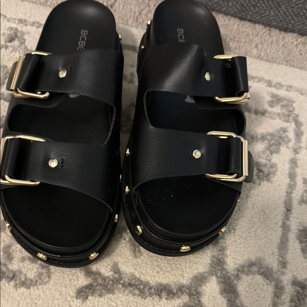 BCBG Black and Gold Sandals with Double Buckle Design